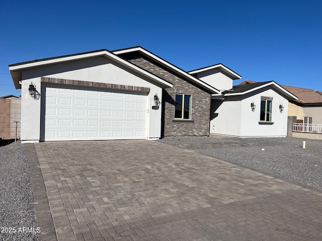 single story home featuring a garage