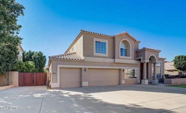 mediterranean / spanish-style home featuring a garage