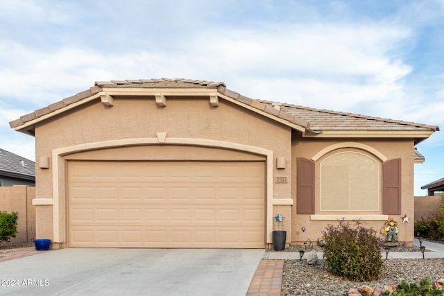 view of front of property with a garage