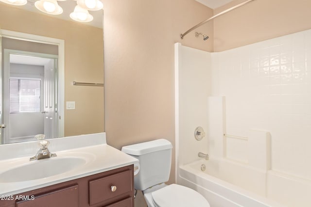 bathroom featuring  shower combination, vanity, and toilet