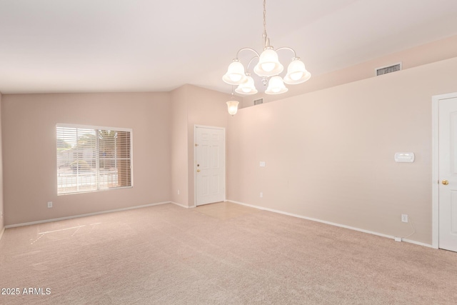 empty room featuring an inviting chandelier, baseboards, visible vents, and light colored carpet