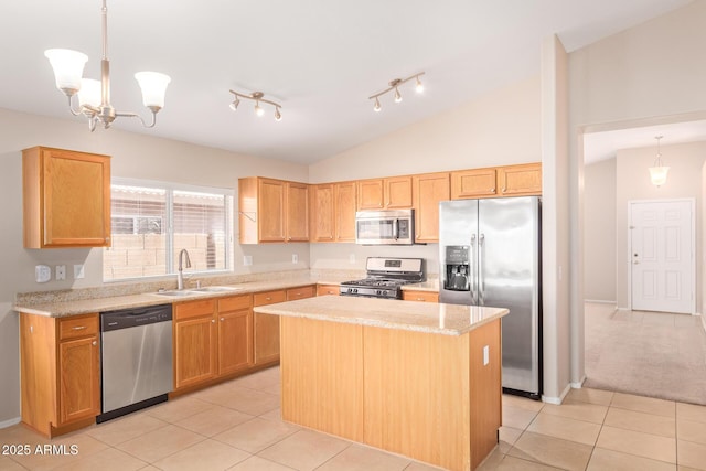 kitchen featuring light tile patterned floors, stainless steel appliances, a kitchen island, a sink, and vaulted ceiling