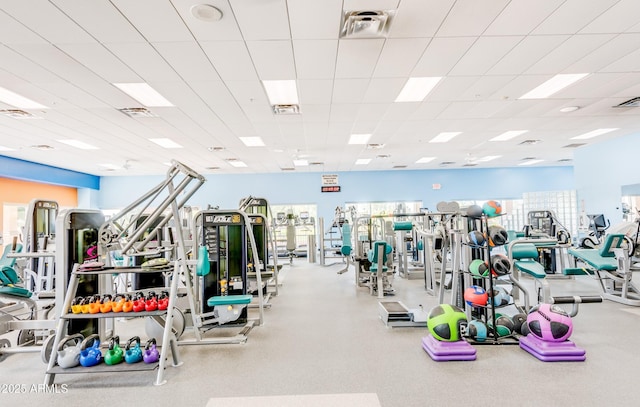 workout area featuring a paneled ceiling and visible vents