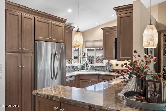 kitchen featuring brown cabinetry and decorative light fixtures