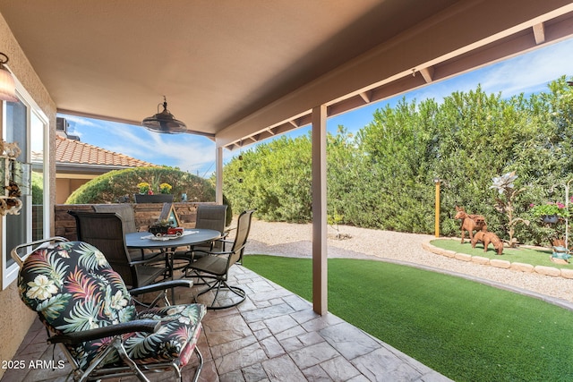 view of patio featuring outdoor dining area