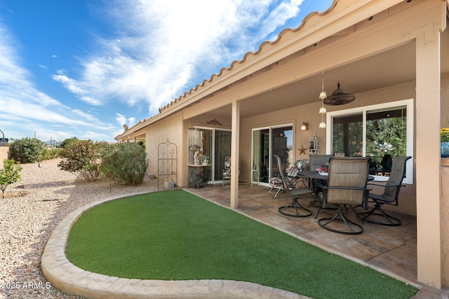 view of patio / terrace featuring ceiling fan and outdoor dining area