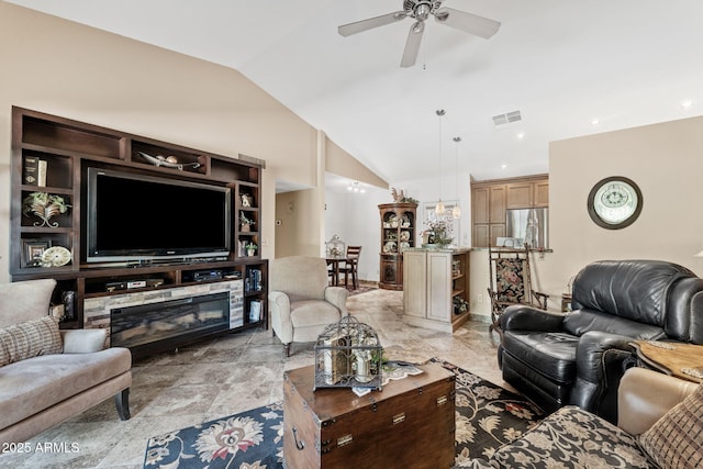 living room featuring lofted ceiling, visible vents, and a ceiling fan