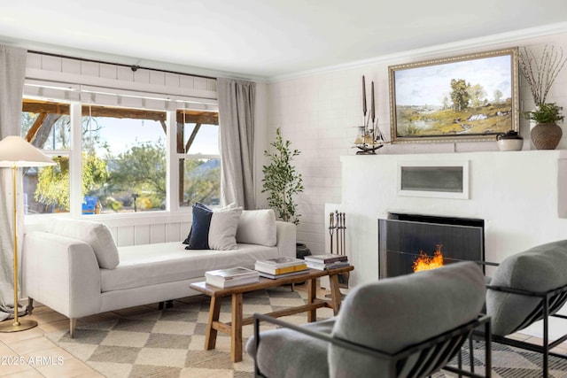 sitting room featuring light tile patterned flooring and crown molding