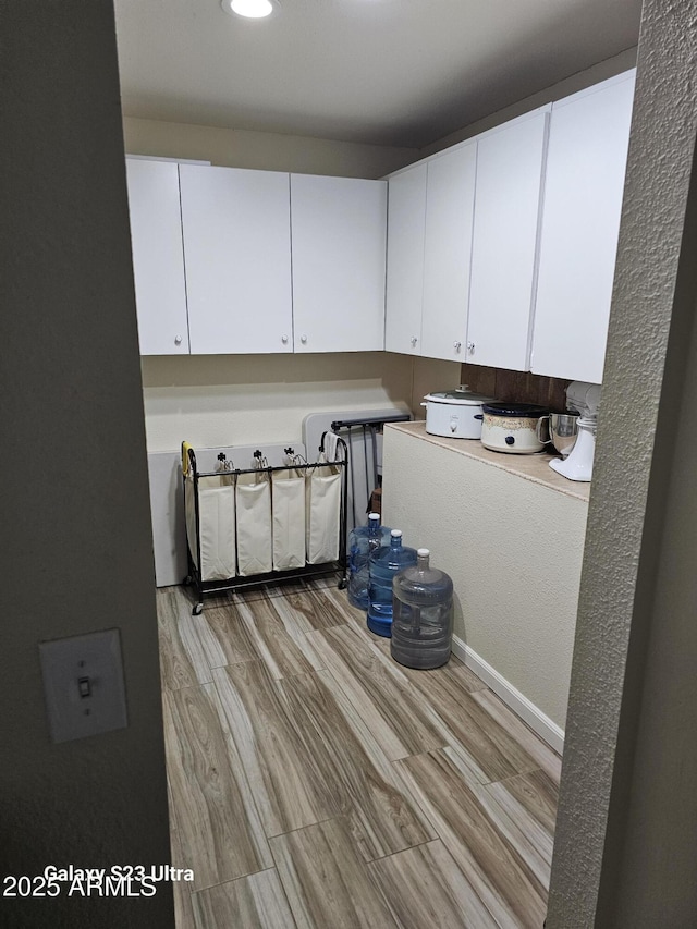 washroom with light wood-type flooring