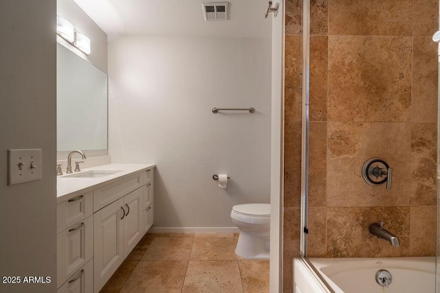 full bathroom featuring vanity, toilet, and tiled shower / bath combo