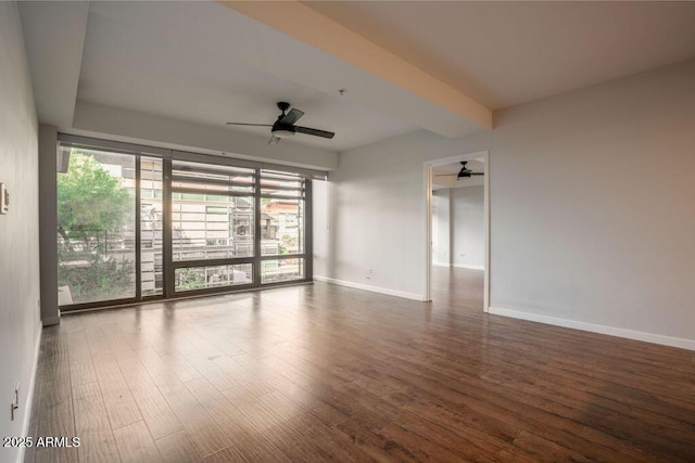 empty room featuring hardwood / wood-style flooring and ceiling fan