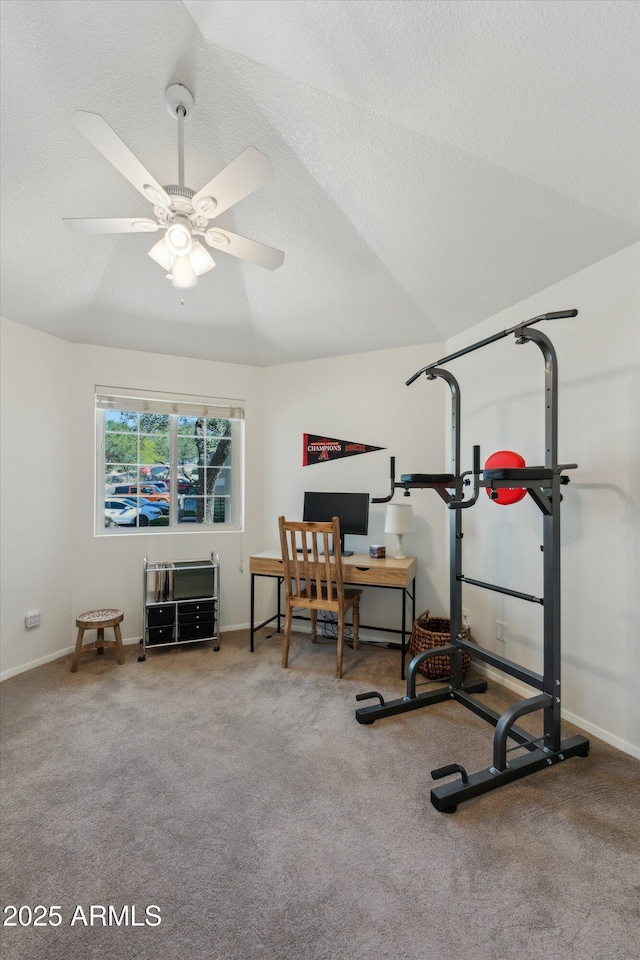 exercise room with carpet floors, lofted ceiling, ceiling fan, a textured ceiling, and baseboards