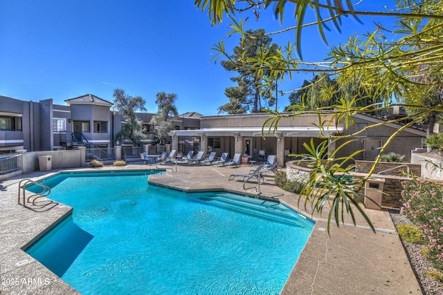 community pool with a patio area