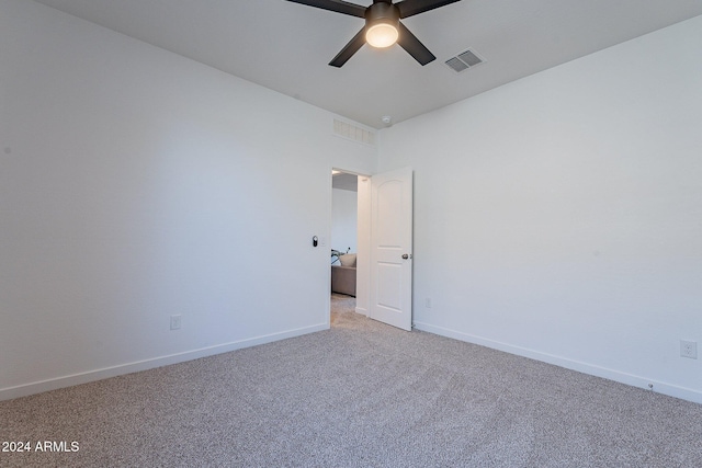 unfurnished room featuring carpet and ceiling fan