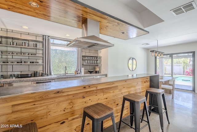 5239 E Waltann Ln, Scottsdale, AZ 85254 - kitchen featuring a sink, island exhaust hood, a chandelier, recessed lighting, and pendant lighting