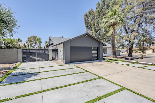 5239 E Waltann Ln, Scottsdale, AZ 85254 - view of front of property featuring a gate, stucco siding, concrete driveway, and an attached garage