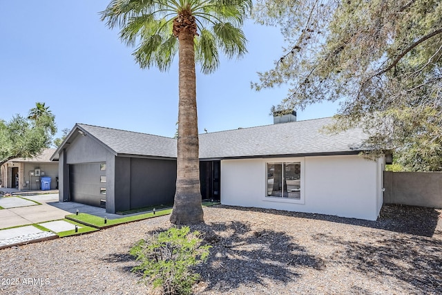 5239 E Waltann Ln, Scottsdale, AZ 85254 - view of front of home featuring stucco siding, roof with shingles, an attached garage, and driveway