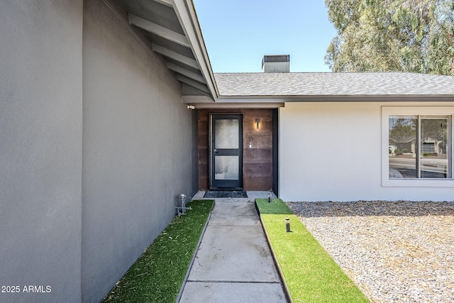 5239 E Waltann Ln, Scottsdale, AZ 85254 - doorway to property with stucco siding and roof with shingles