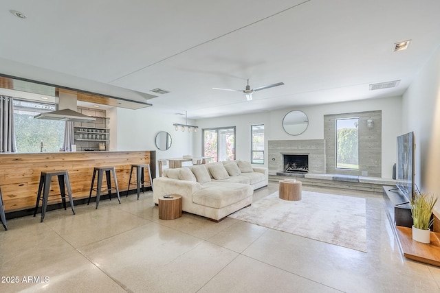 5239 E Waltann Ln, Scottsdale, AZ 85254 - living area featuring ceiling fan and a fireplace
