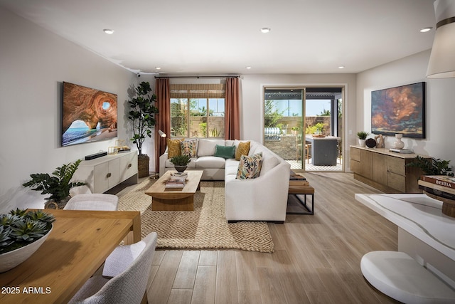 living room featuring recessed lighting and light wood-style floors