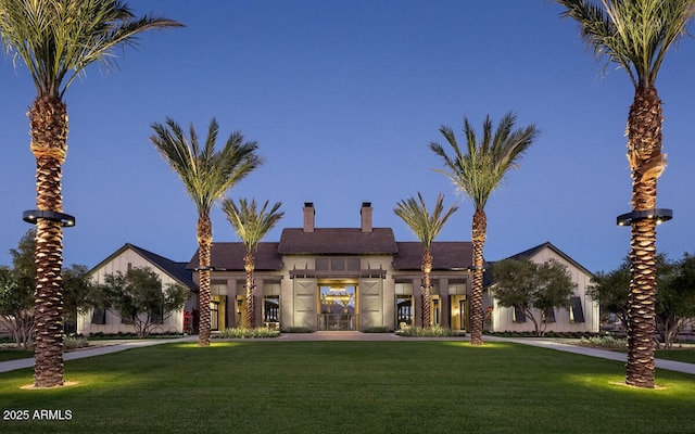 view of front of home with a front lawn