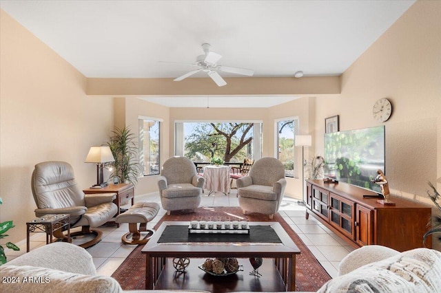 tiled living room with ceiling fan