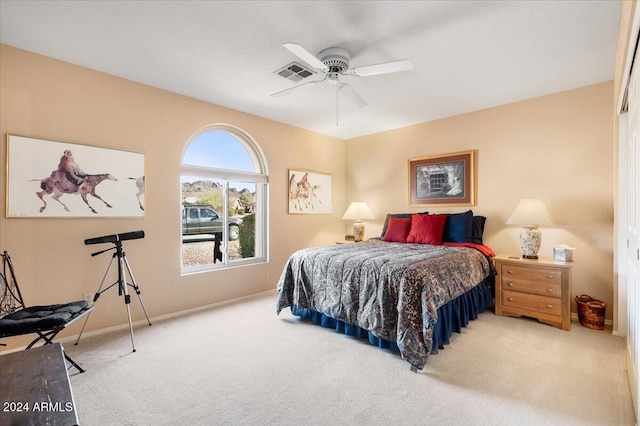 carpeted bedroom featuring ceiling fan