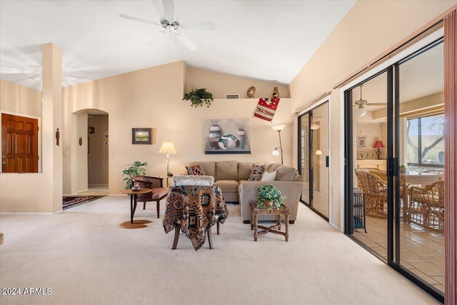 carpeted living room featuring vaulted ceiling