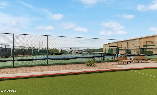 view of property's community with tennis court