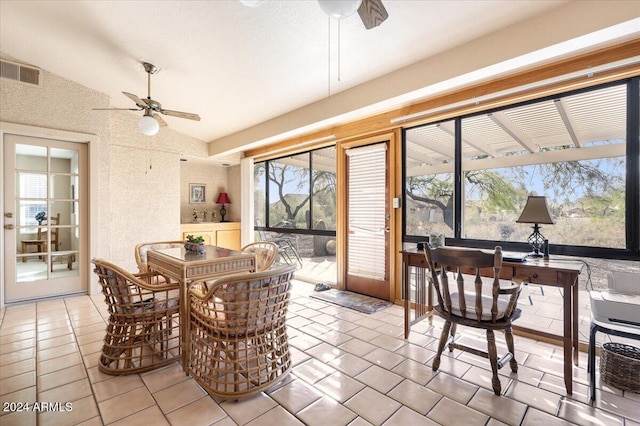 dining area featuring vaulted ceiling, ceiling fan, and plenty of natural light