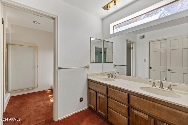 bathroom with vanity and an enclosed shower