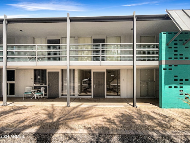 rear view of property featuring a patio