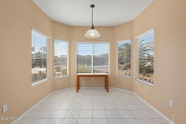 dining space with light tile patterned floors