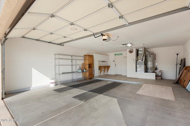 garage featuring gas water heater and a garage door opener