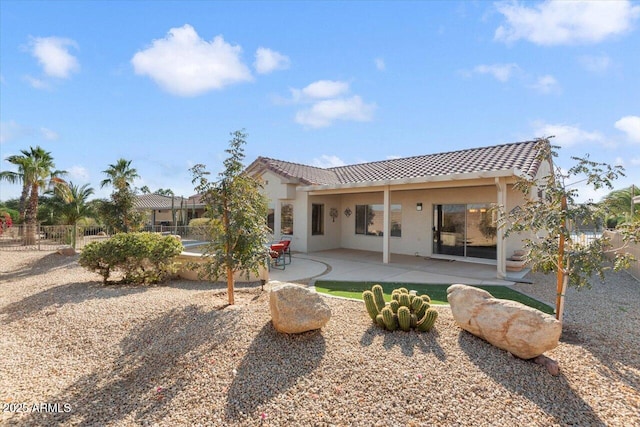 back of property featuring a patio area