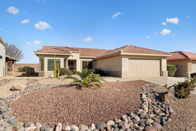 mediterranean / spanish-style home with a garage