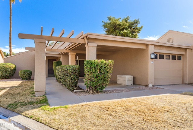 view of front of property with a garage and a carport