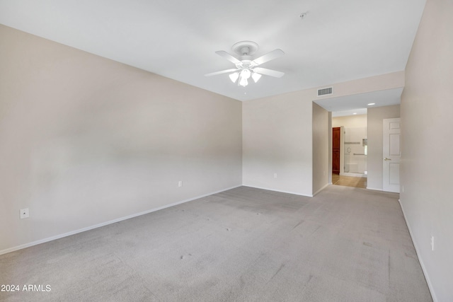 carpeted empty room with ceiling fan