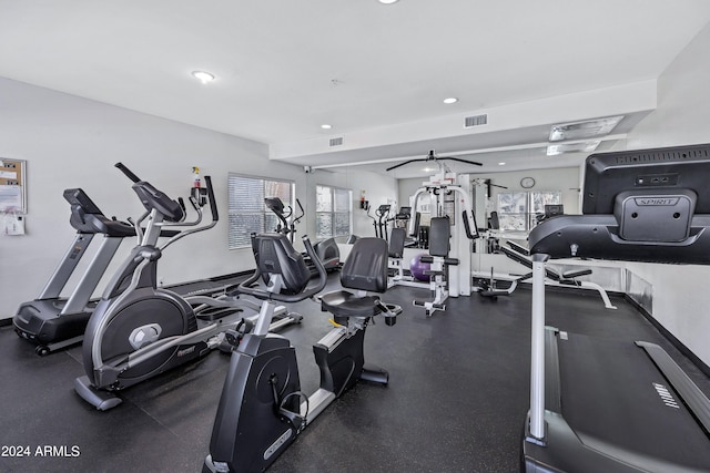 exercise room with ceiling fan