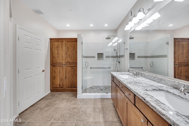 bathroom featuring vanity, tile patterned floors, and an enclosed shower