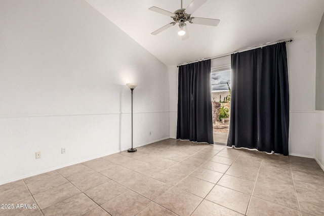 unfurnished room with light tile patterned floors, lofted ceiling, and ceiling fan