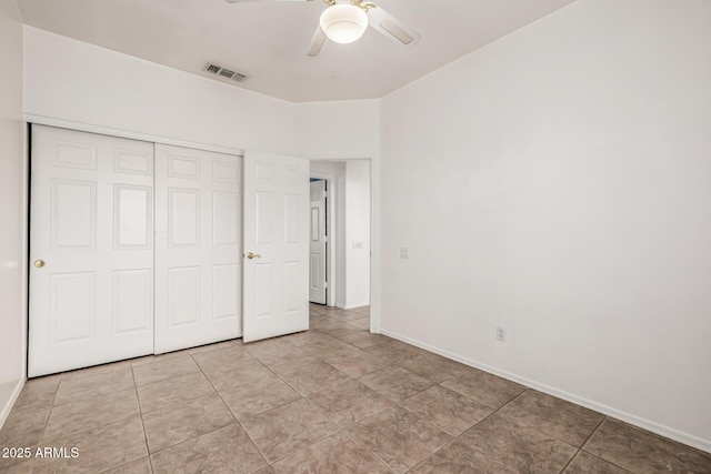 unfurnished bedroom with visible vents, ceiling fan, baseboards, light tile patterned floors, and a closet