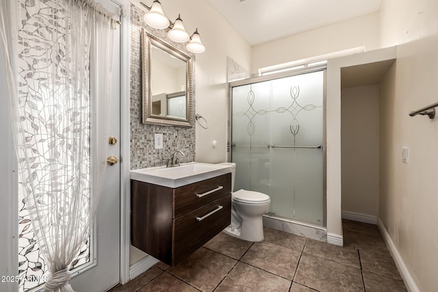 full bathroom with vanity, a shower stall, tile patterned floors, toilet, and tasteful backsplash