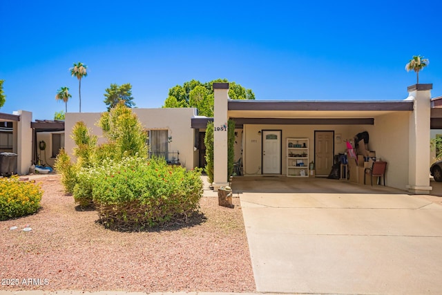 1951 E Del Sur Dr, Tempe, AZ 85283 - view of front facade with stucco siding, concrete driveway, and an attached carport