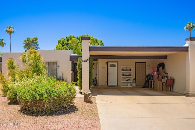 1951 E Del Sur Dr, Tempe, AZ 85283 - view of front facade with stucco siding, driveway, and an attached carport