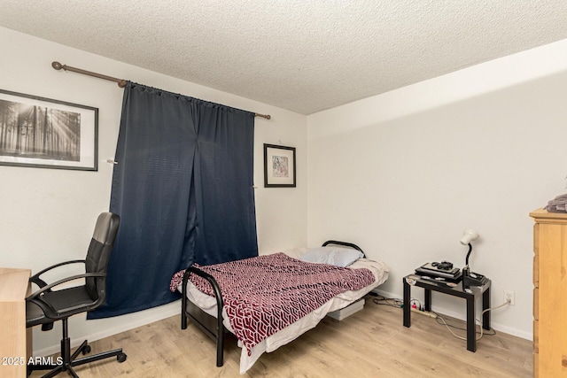 1951 E Del Sur Dr, Tempe, AZ 85283 - bedroom with light wood-type flooring and a textured ceiling