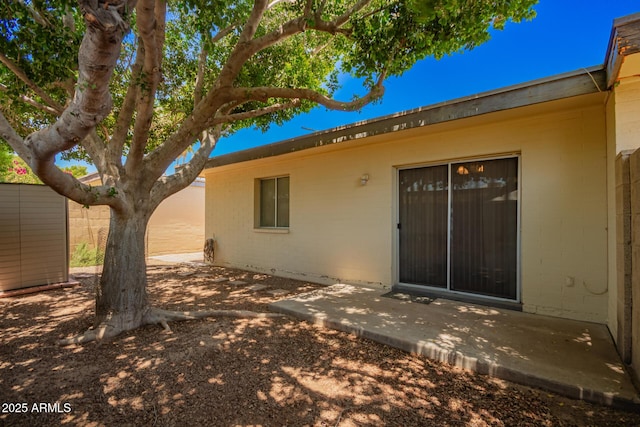 1951 E Del Sur Dr, Tempe, AZ 85283 - entrance to property with a patio area and concrete block siding