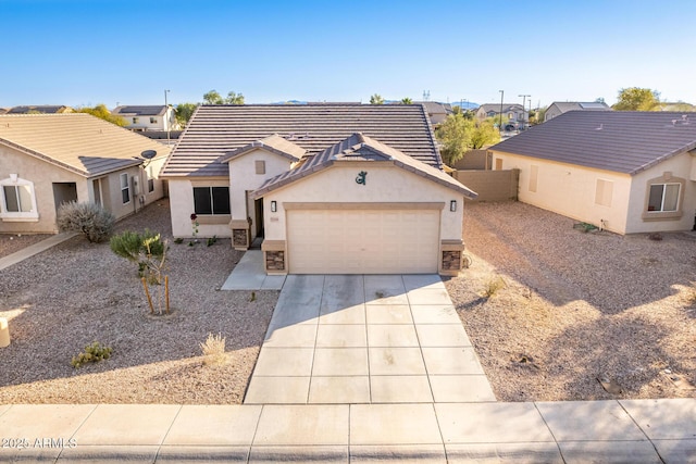 ranch-style house featuring a garage