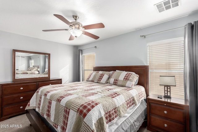 bedroom with ceiling fan and carpet floors