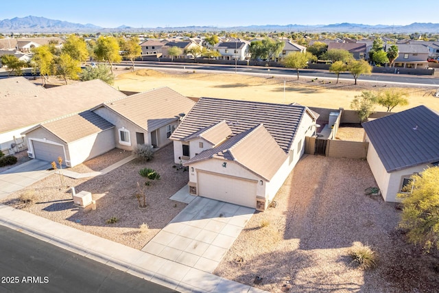 birds eye view of property featuring a mountain view